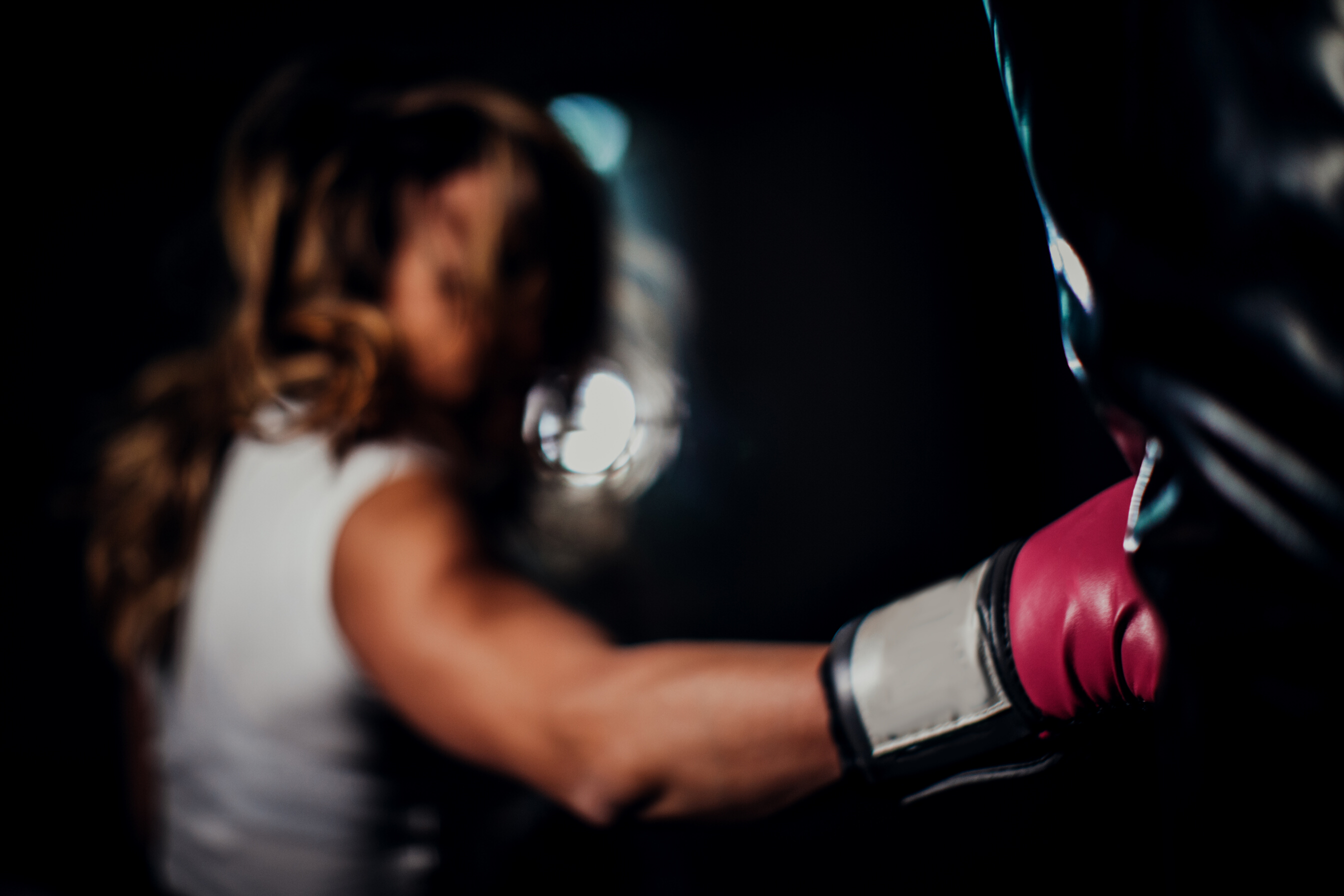 Woman punching a punching bag